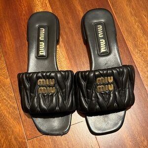 Miu Miu Black Quilted Slides with Gold Logo